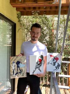 Baptiste Dubois with his paintings